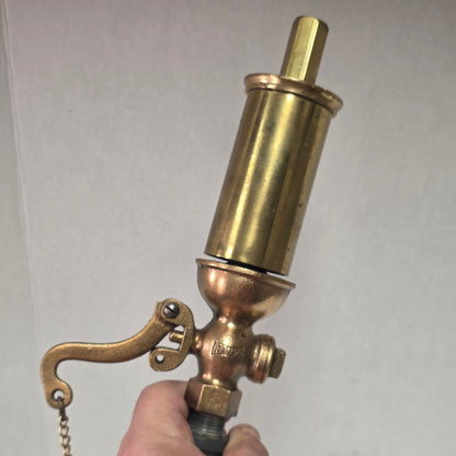 Antique Pemberthy brass steam whistle with iron pipe fitting
