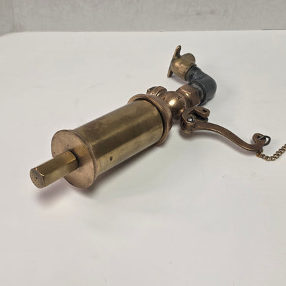 Antique Pemberthy brass steam whistle with iron pipe fitting
