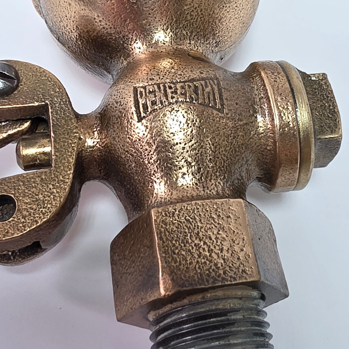 Antique Pemberthy brass steam whistle with iron pipe fitting
