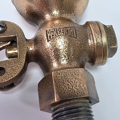 Antique Pemberthy brass steam whistle with iron pipe fitting
