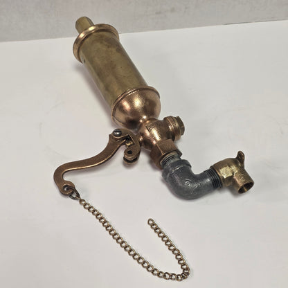 Antique Pemberthy brass steam whistle with iron pipe fitting
