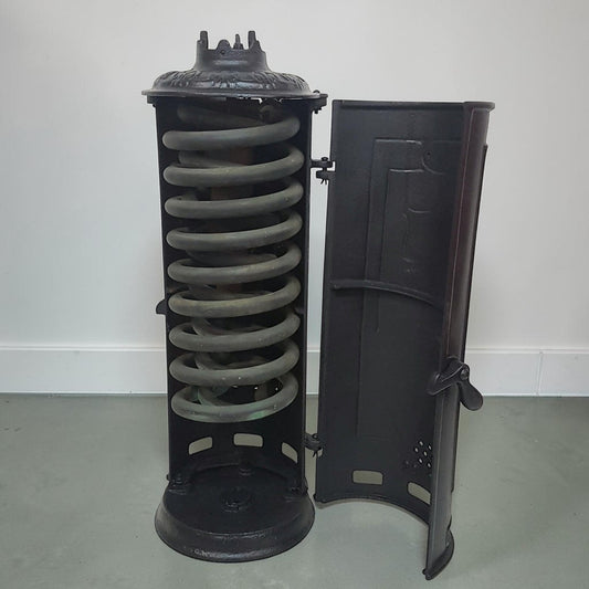 Antique RUUD No. 25 cast iron hot water heater tank.
