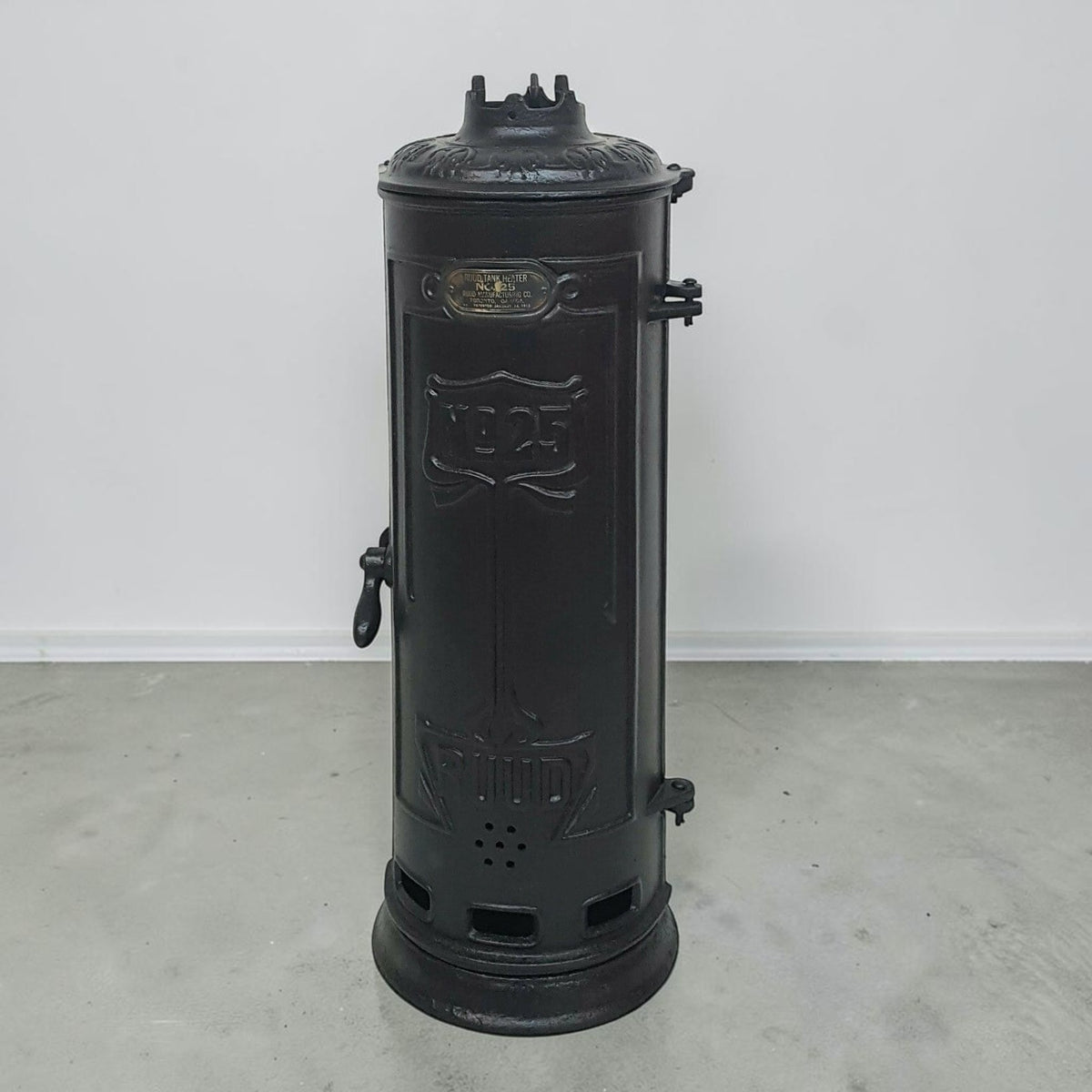 Antique RUUD No. 25 cast iron hot water heater tank.
