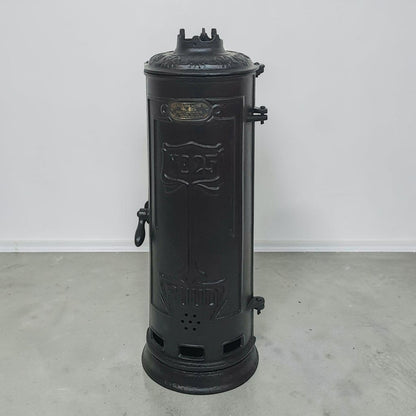 Antique RUUD No. 25 cast iron hot water heater tank.
