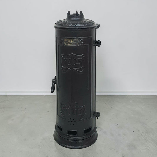 Antique RUUD No. 25 cast iron hot water heater tank.

