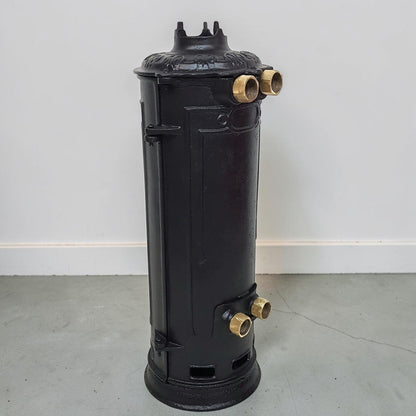 Antique RUUD No. 25 cast iron hot water heater tank.
