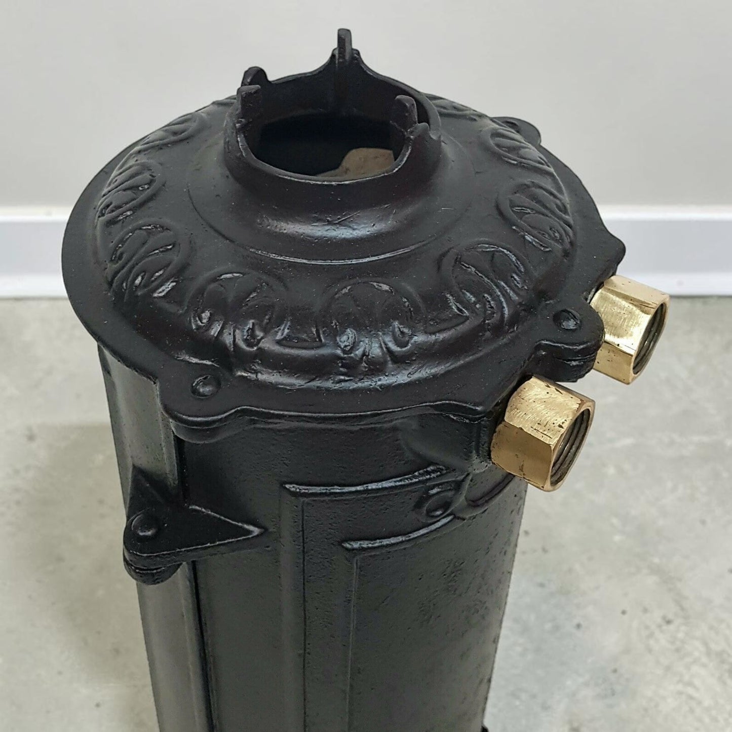 Antique RUUD No. 25 cast iron hot water heater tank.
