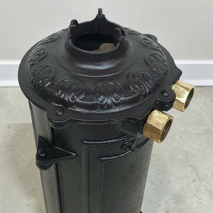 Antique RUUD No. 25 cast iron hot water heater tank.
