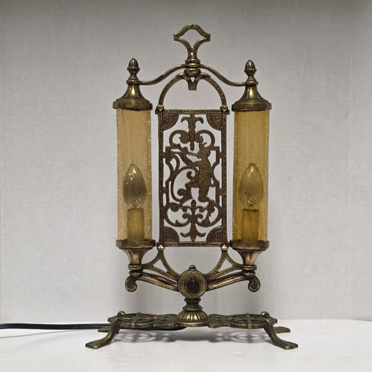 Exceptional Art Deco Mutual Sunset bronze lamp with Pan figure, original patina, and amber glass shades.