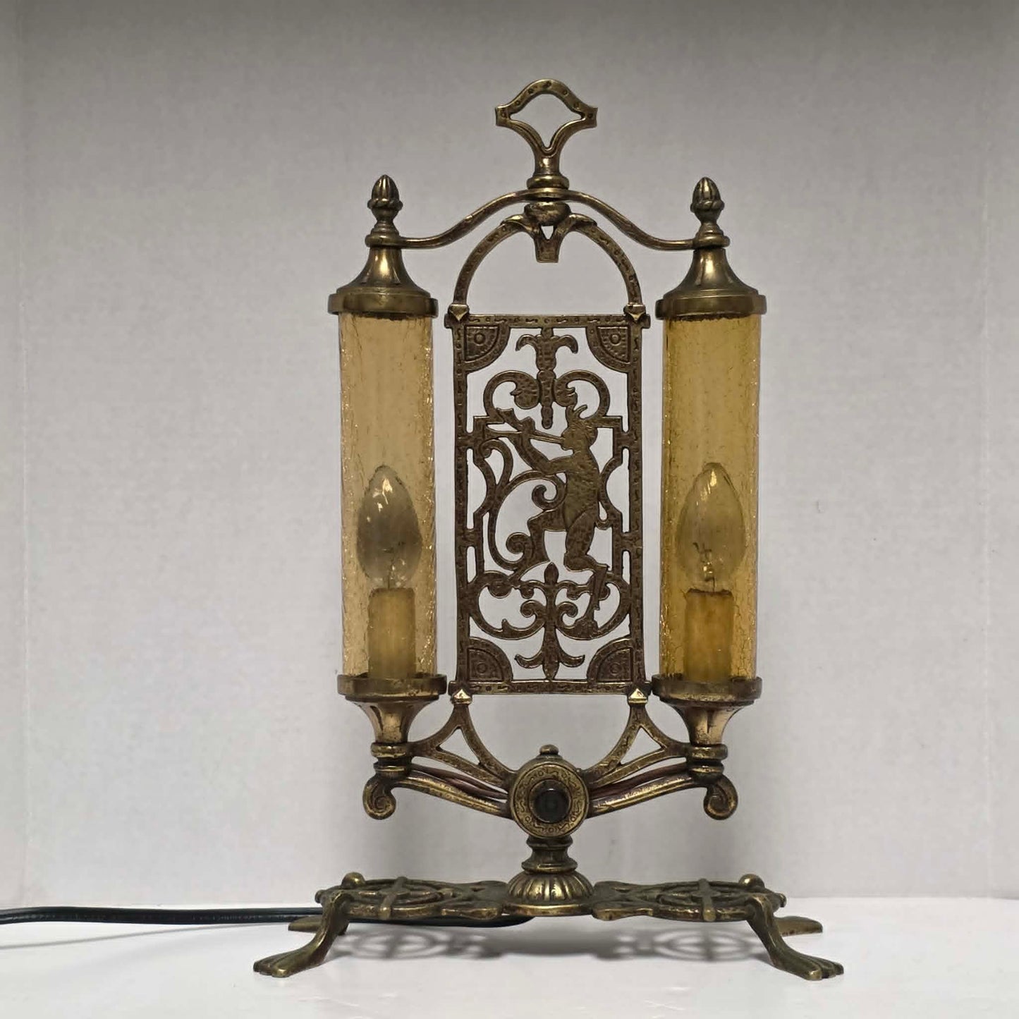 Exceptional Art Deco Mutual Sunset bronze lamp with Pan figure, original patina, and amber glass shades.