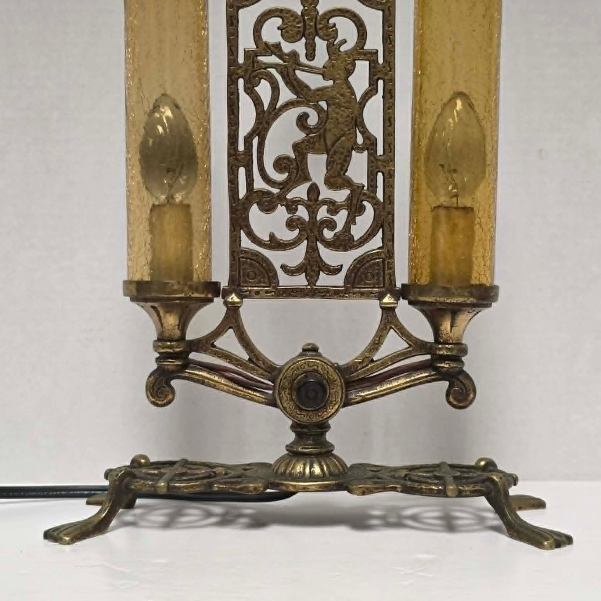Exceptional Art Deco Mutual Sunset bronze lamp with Pan figure, original patina, and amber glass shades.