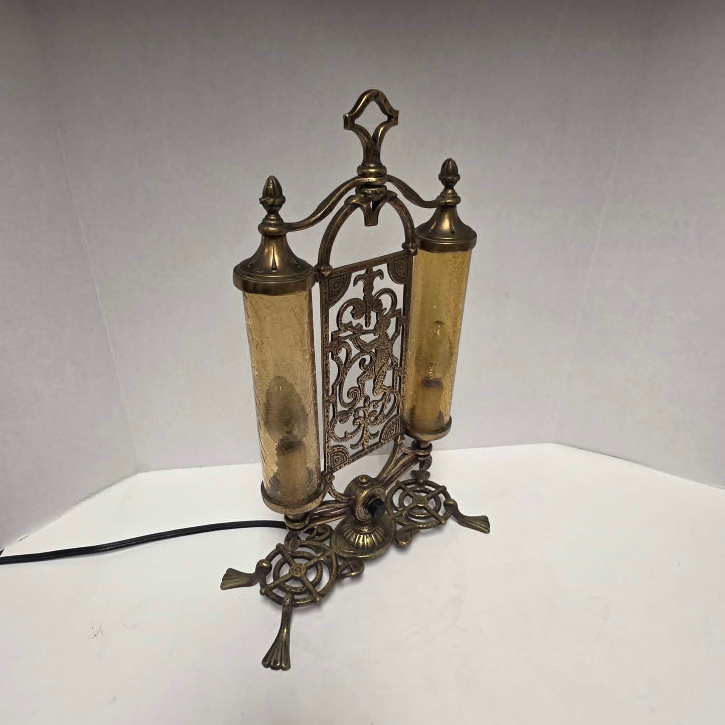 Exceptional Art Deco Mutual Sunset bronze lamp with Pan figure, original patina, and amber glass shades.