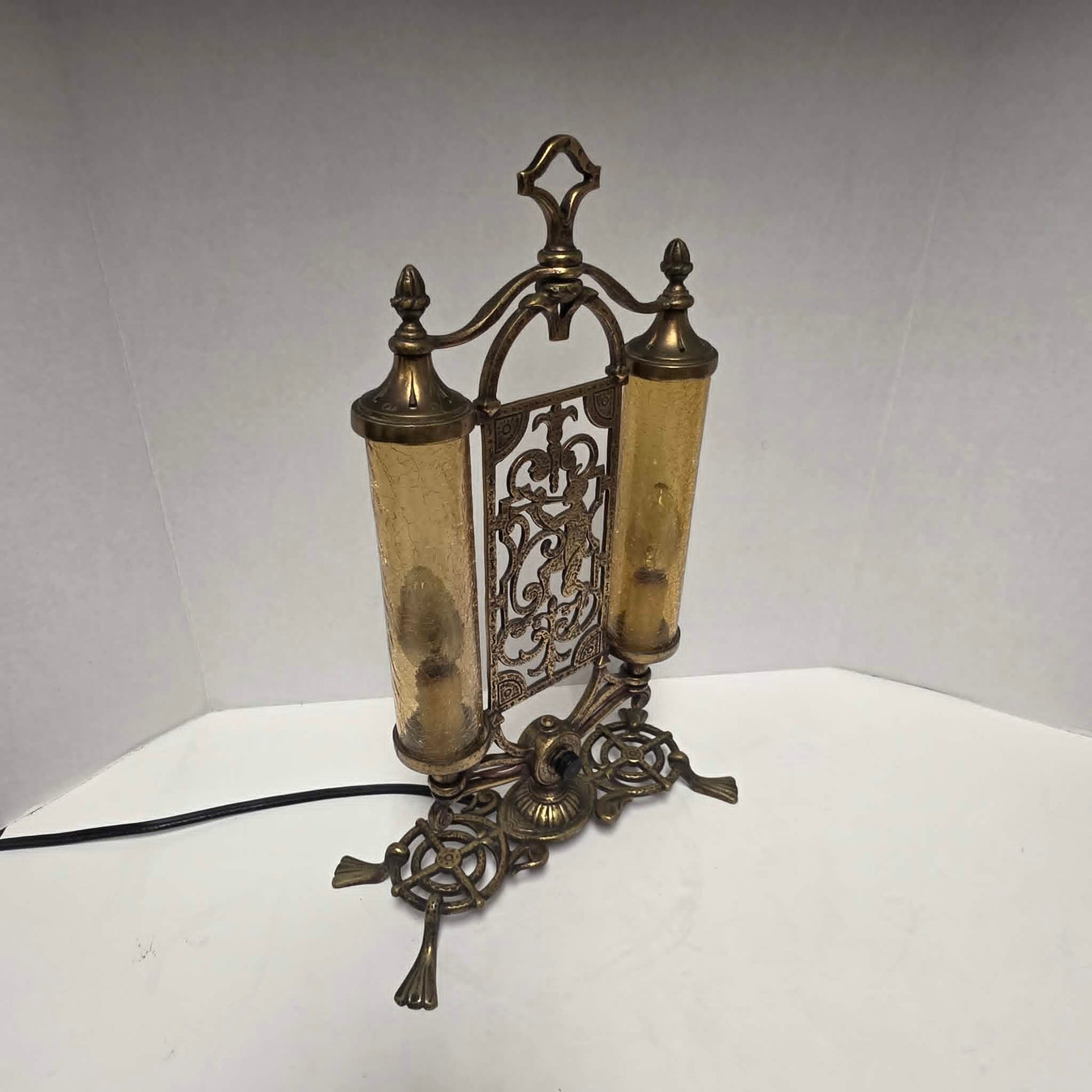 Exceptional Art Deco Mutual Sunset bronze lamp with Pan figure, original patina, and amber glass shades.