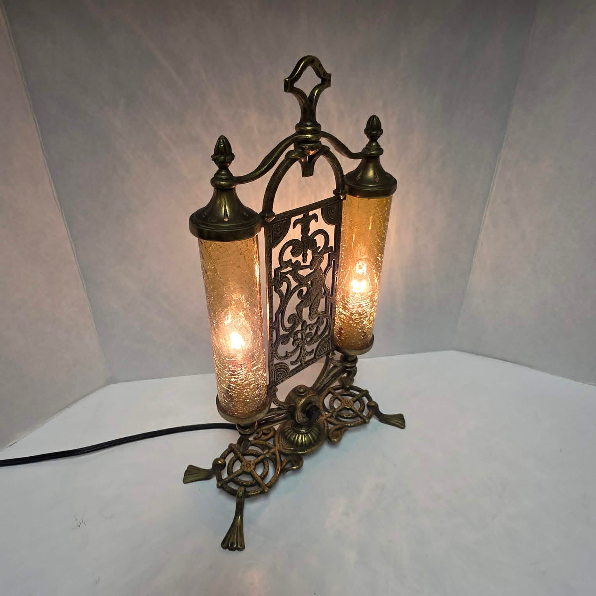 Exceptional Art Deco Mutual Sunset bronze lamp with Pan figure, original patina, and amber glass shades.