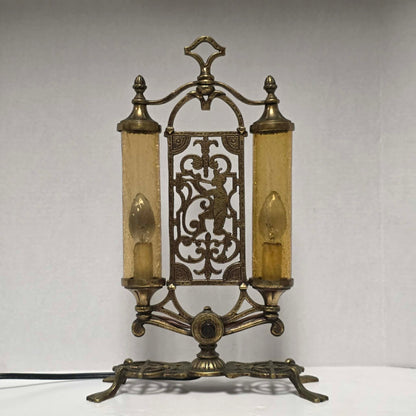 Exceptional Art Deco Mutual Sunset bronze lamp with Pan figure, original patina, and amber glass shades.