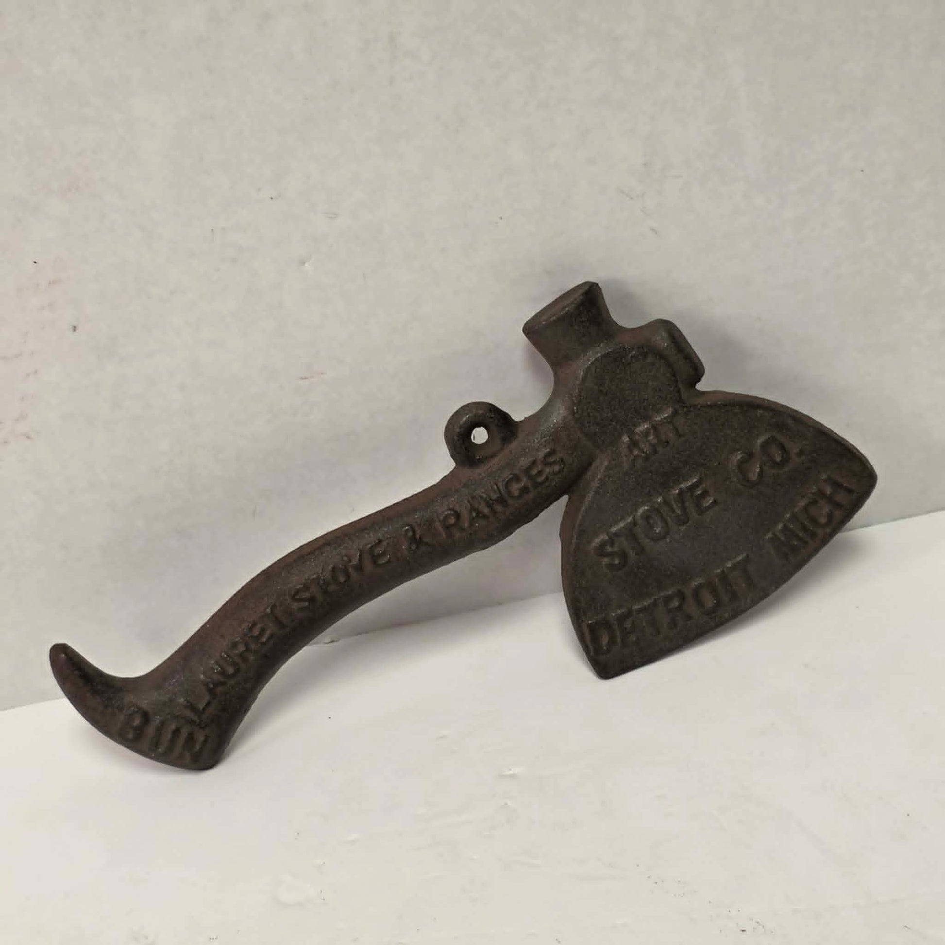 Early 1900s cast iron Carrie Nation temperance advertising axe with detailed relief portrait and slogan.