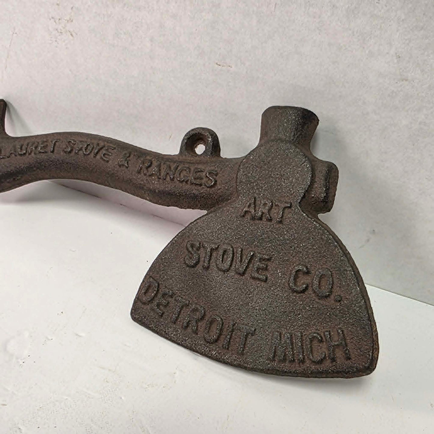 Early 1900s cast iron Carrie Nation temperance advertising axe with detailed relief portrait and slogan.