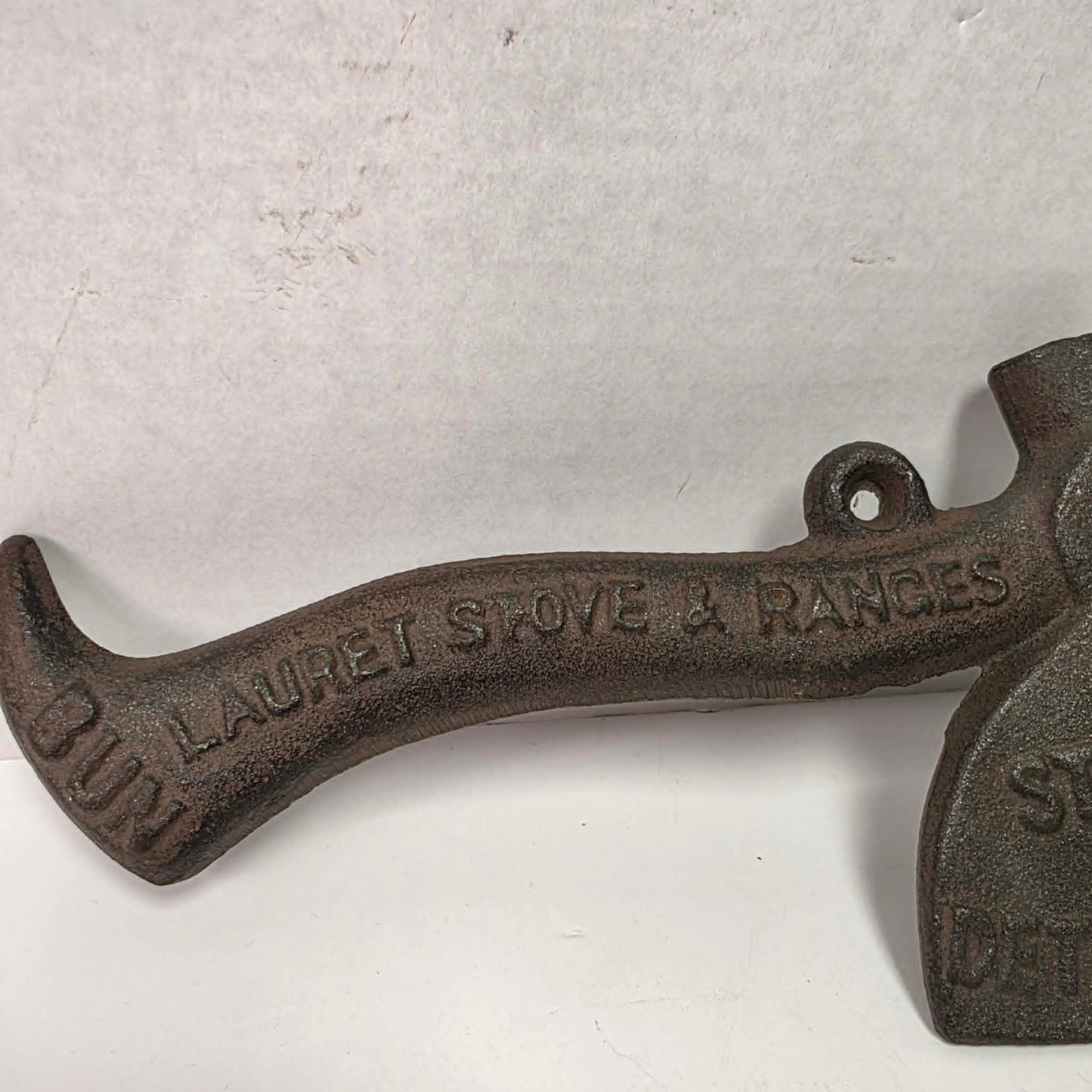 Early 1900s cast iron Carrie Nation temperance advertising axe with detailed relief portrait and slogan.
