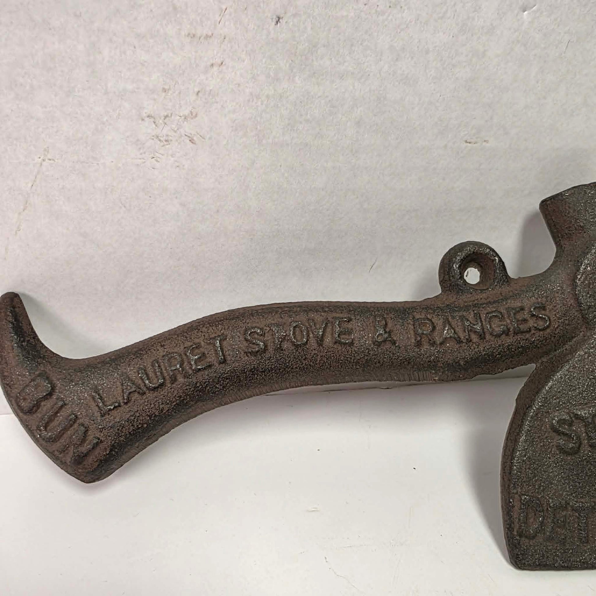 Early 1900s cast iron Carrie Nation temperance advertising axe with detailed relief portrait and slogan.