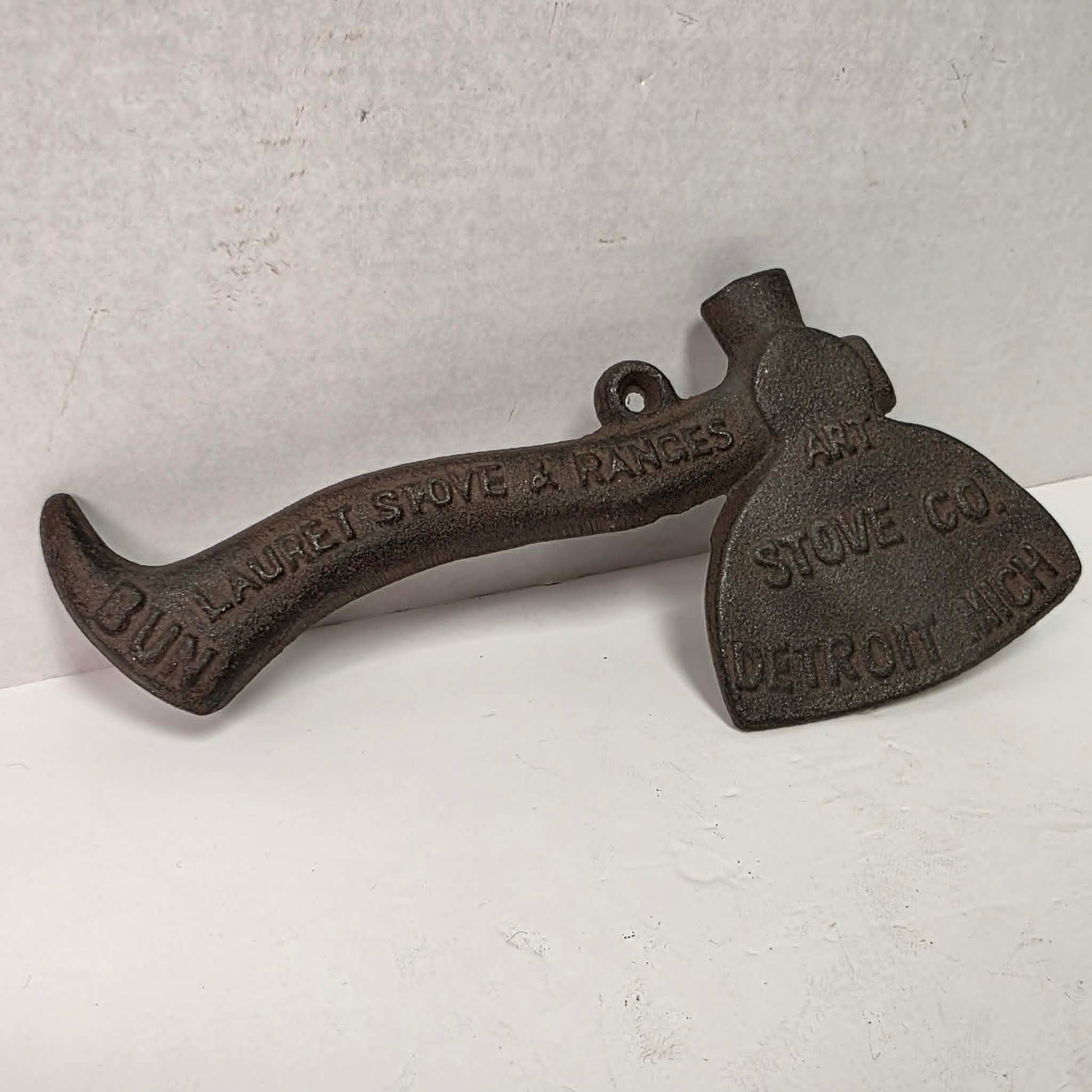 Early 1900s cast iron Carrie Nation temperance advertising axe with detailed relief portrait and slogan.