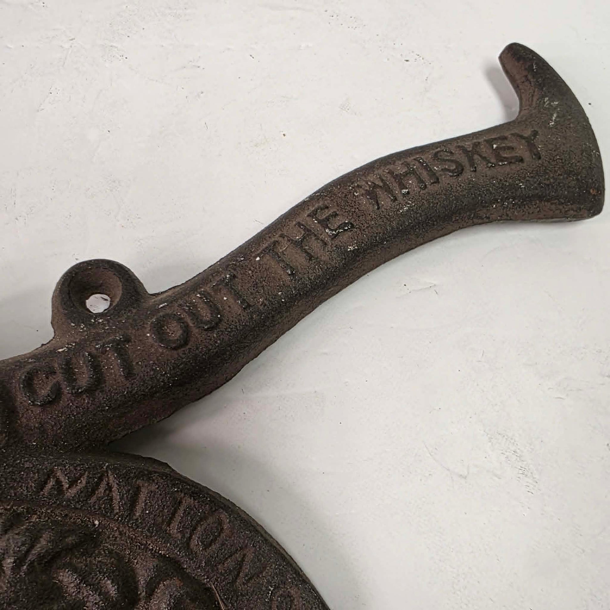 Early 1900s cast iron Carrie Nation temperance advertising axe with detailed relief portrait and slogan.