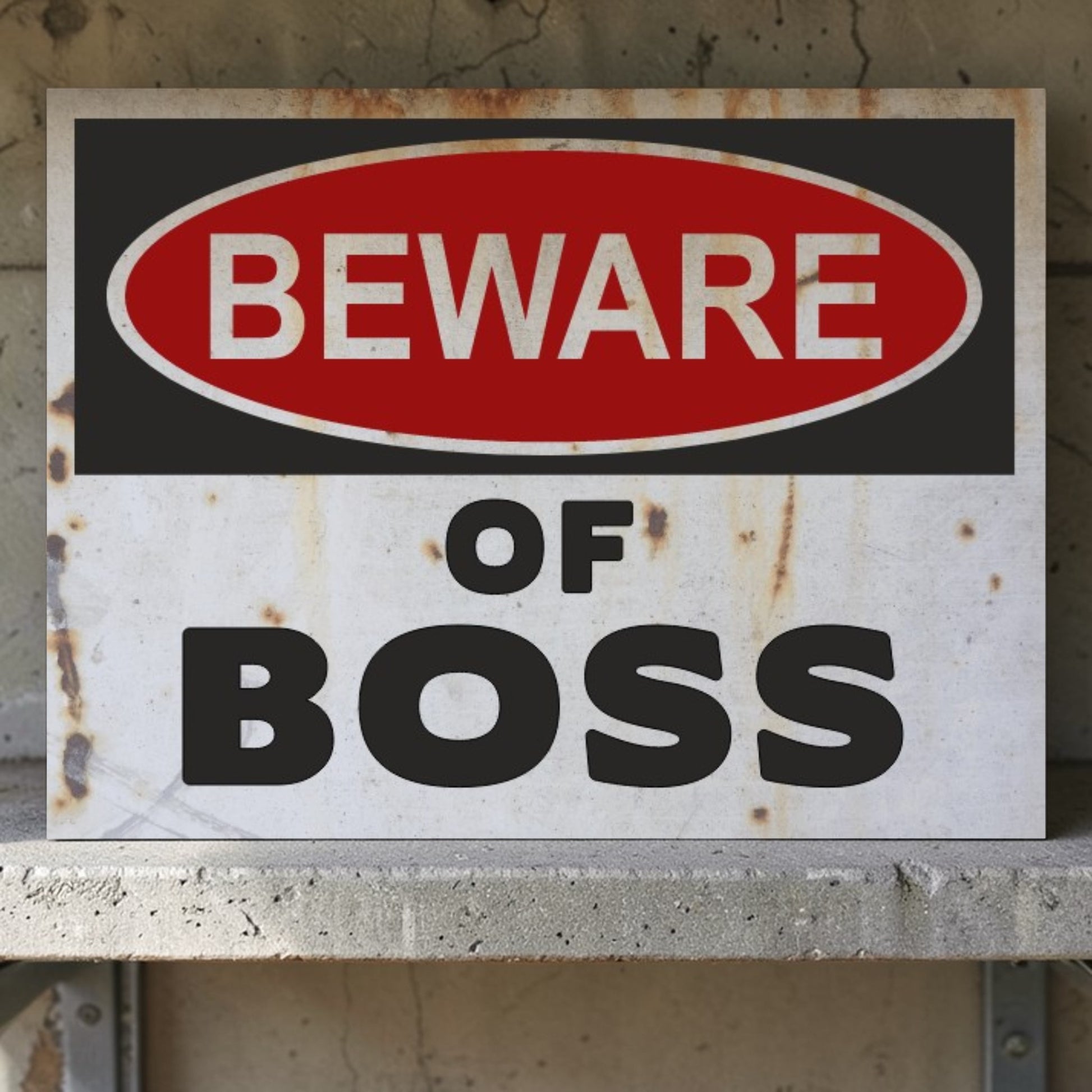 Rust-covered sign with 'Beware of Boss' text on a concrete wall.