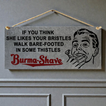 Vintage-style sign with humorous text and illustration of a man holding a razor, hanging on a door.
