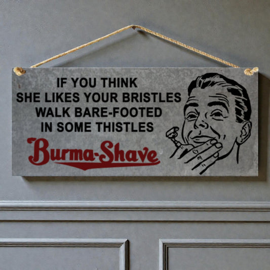 Vintage-style sign with humorous text and illustration of a man holding a razor, hanging on a door.