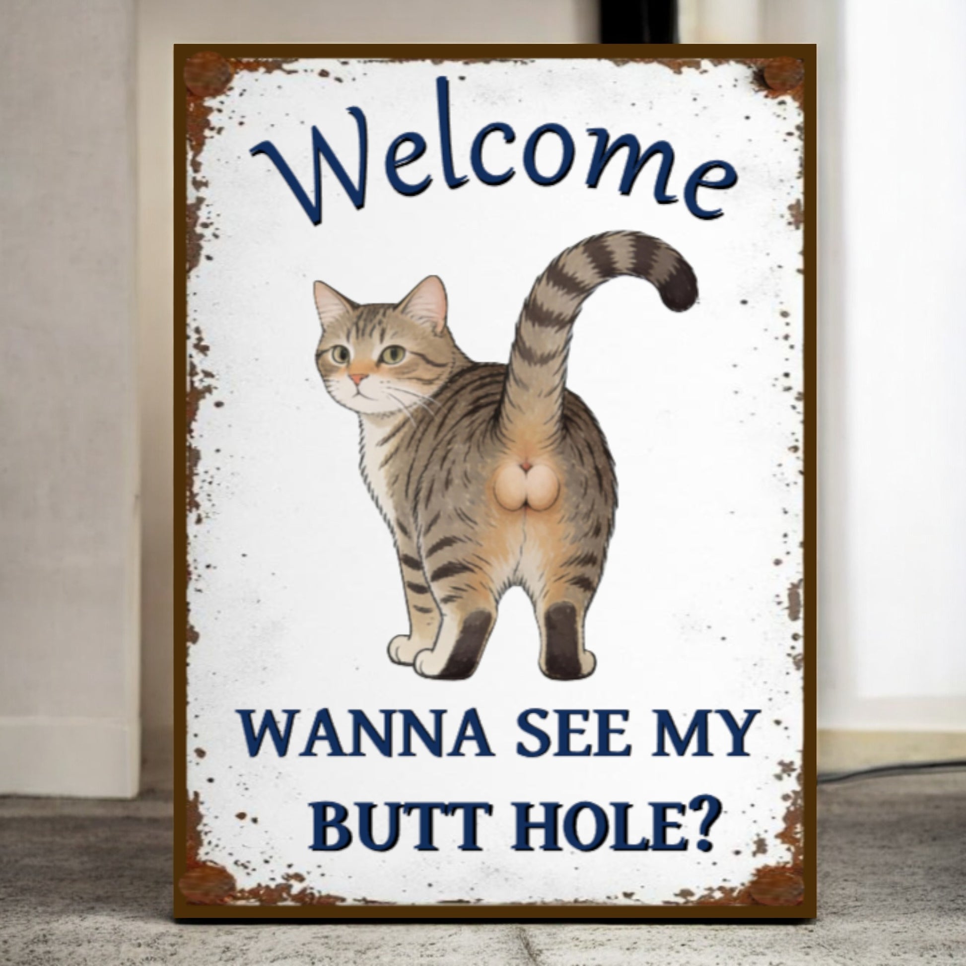 Sign with a cat illustration and humorous text on a white background