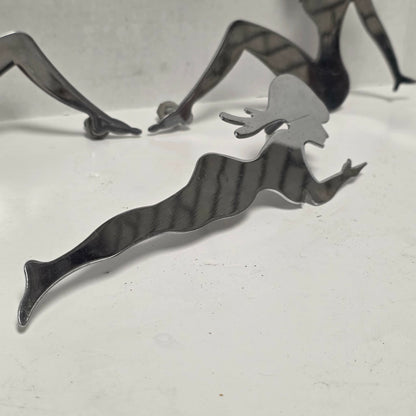 Set of three stainless steel vintage trucker mud flap girl decorations.
