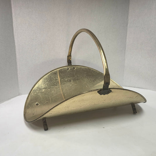 A beautiful vintage brass log holder that keeps firewood organized while adding classic elegance to your hearth.