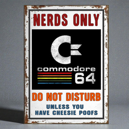 Vintage-style sign with 'Nerds Only' and 'Commodore 64' text on a gray background