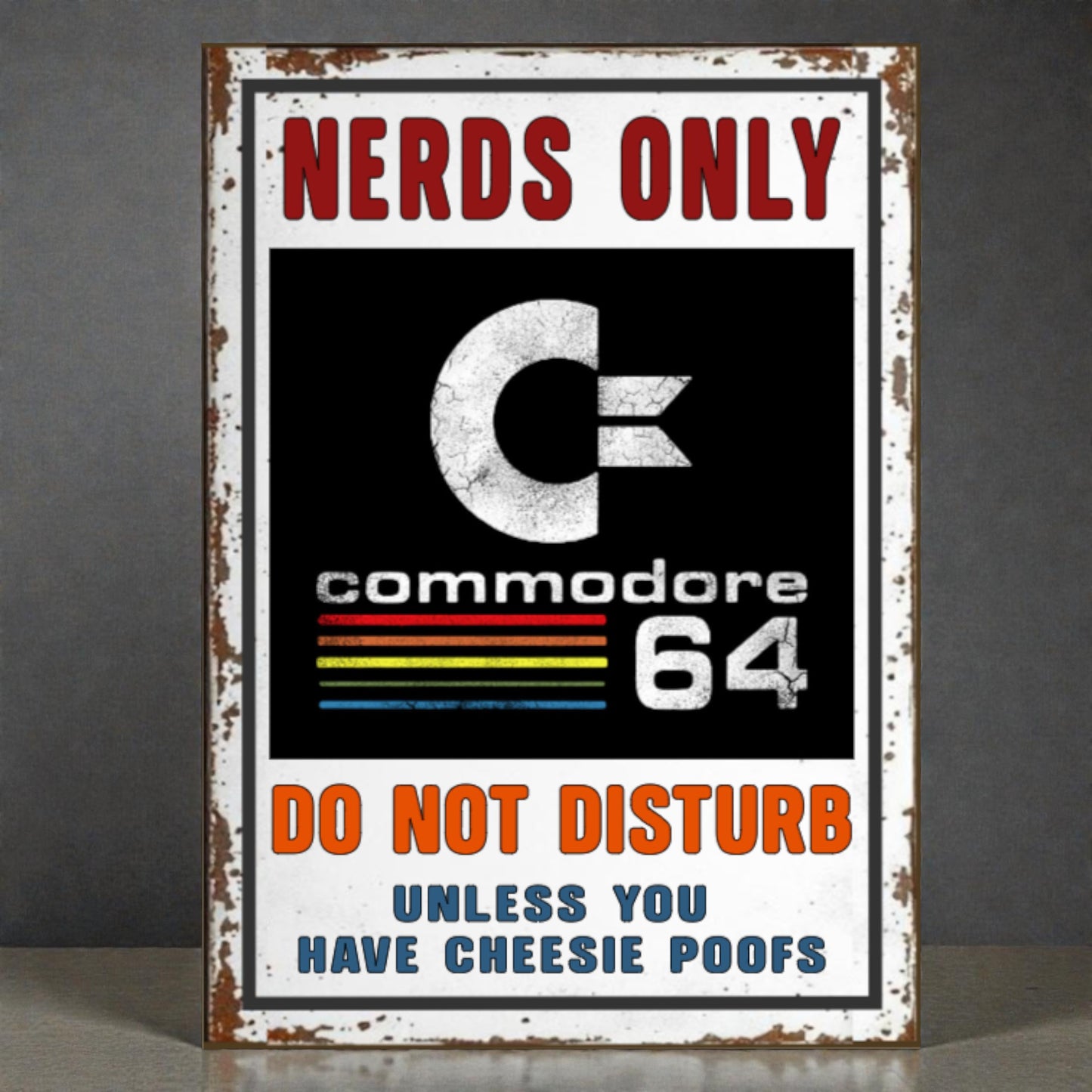 Vintage-style sign with Commodore 64 logo and humorous text on a dark background