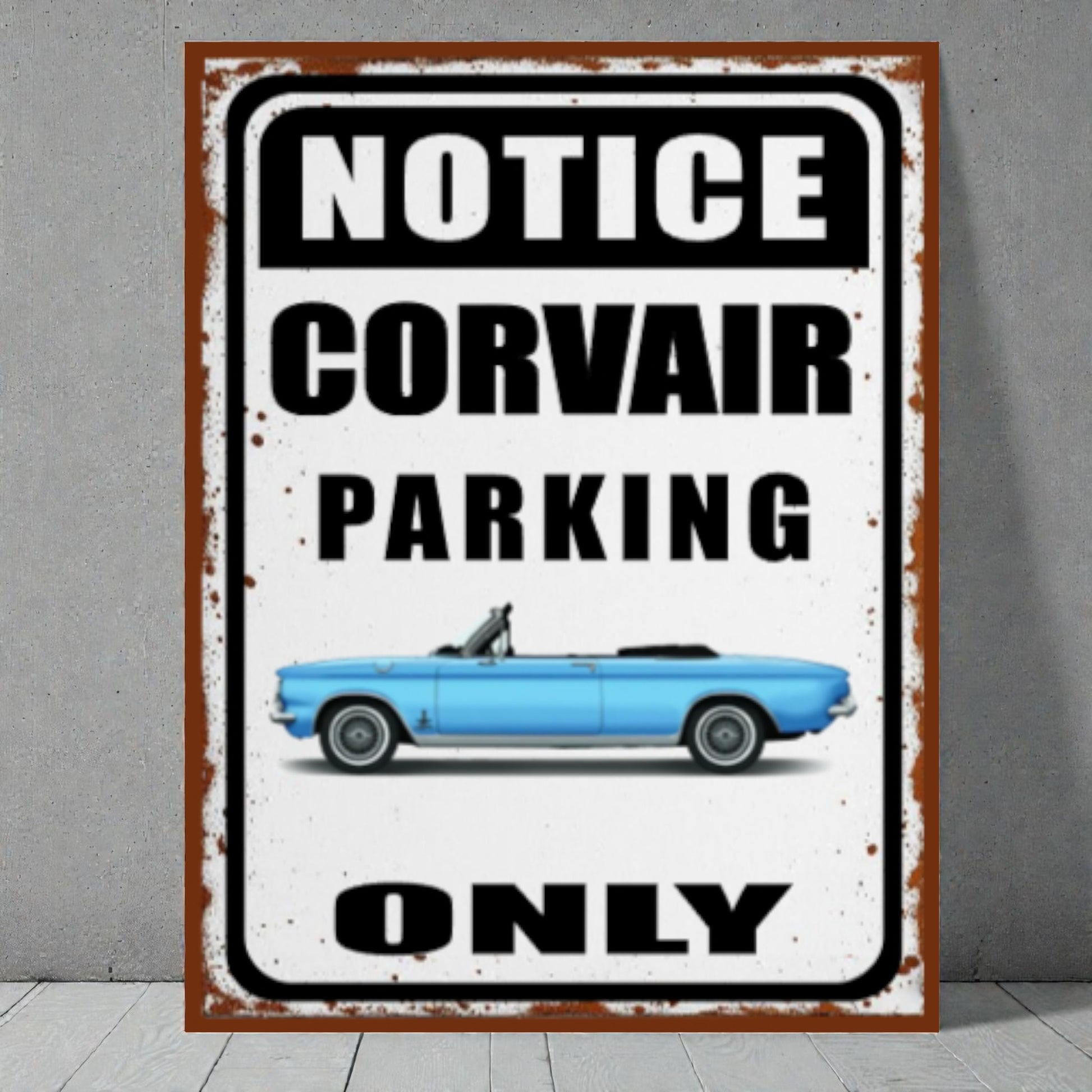 Vintage-style metal sign with a blue Corvair car and text 'Notice Corvair Parking Only' on a gray background.