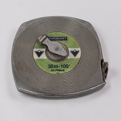 Metal tape measure with 'Mastercraft' branding on a white background