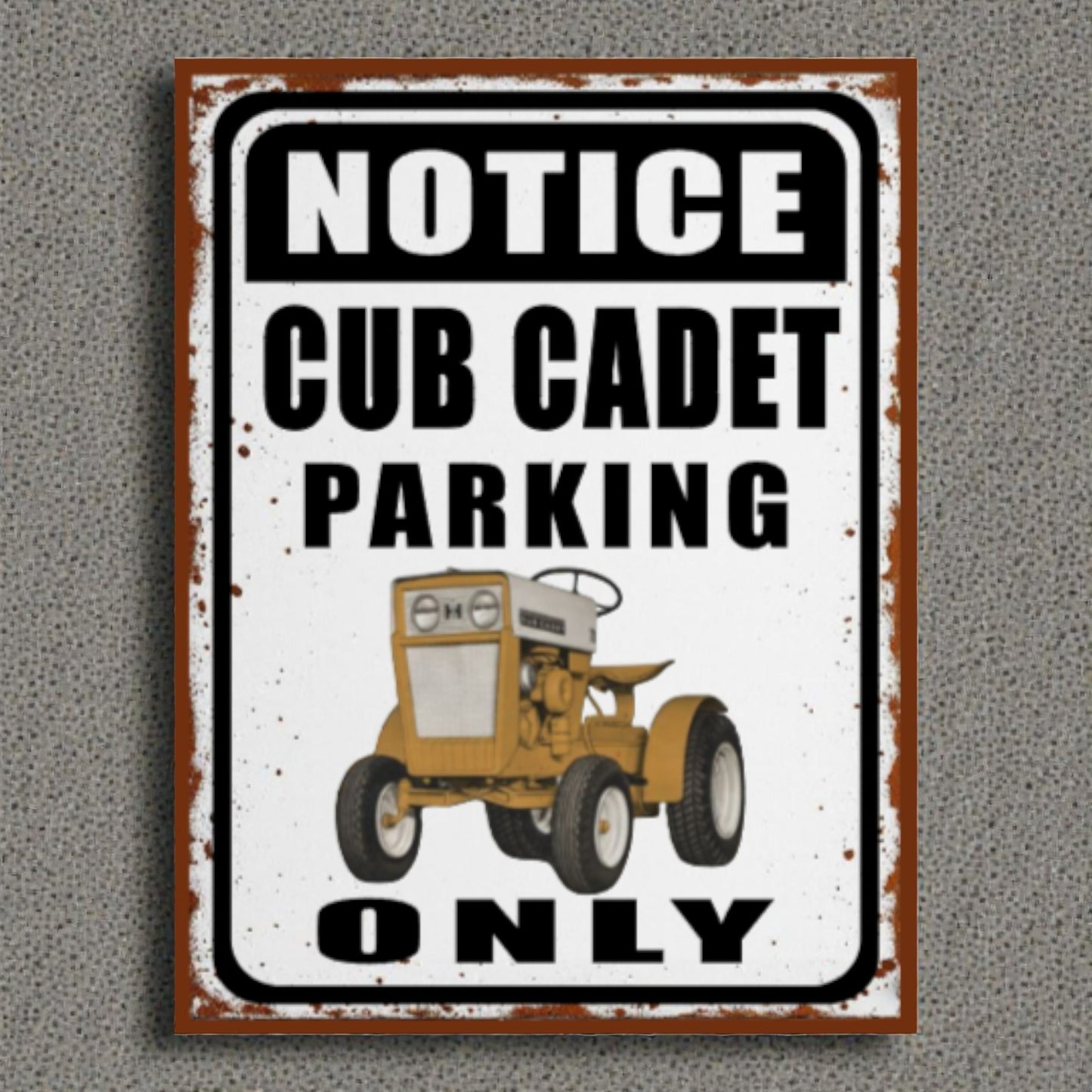 Vintage-style sign with a Cub Cadet tractor illustration and text on a gray background