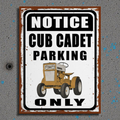 Metal sign with a vintage tractor illustration and text 'Notice Cub Cadet Parking Only' on a textured gray background.