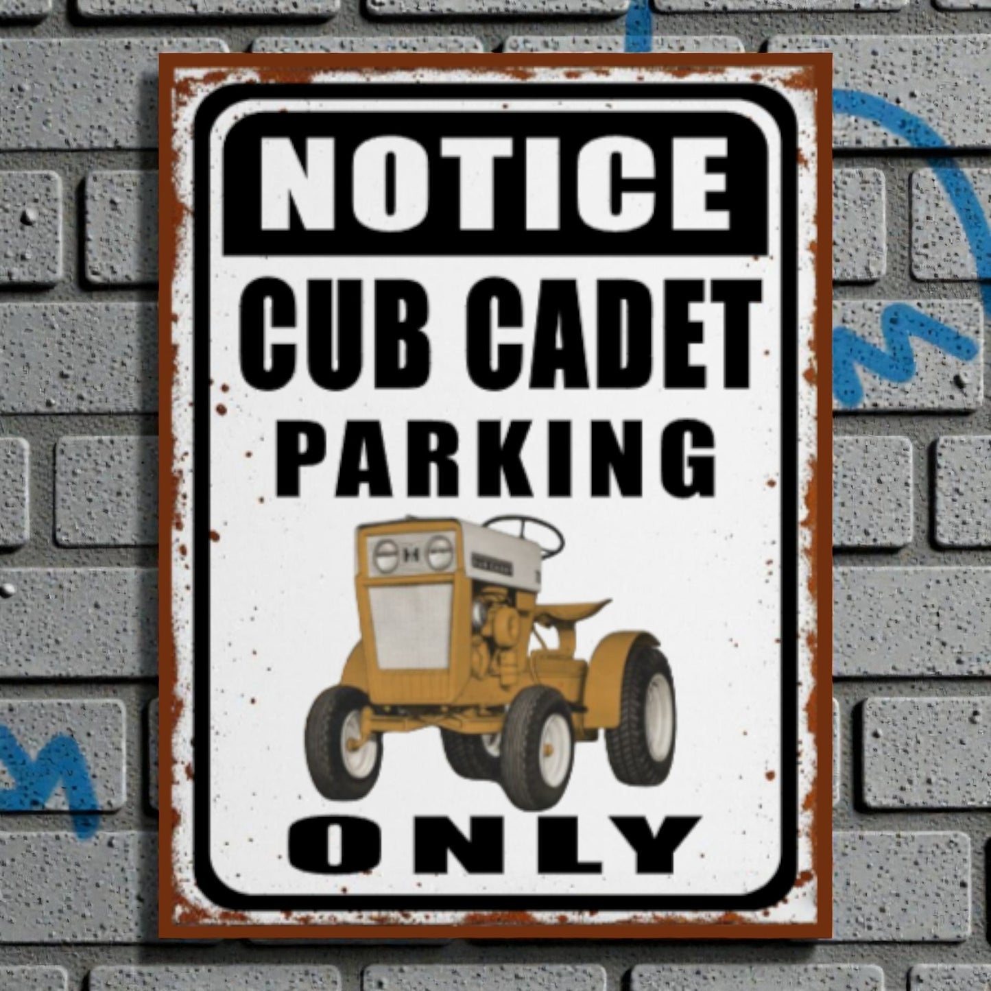Vintage-style sign with a Cub Cadet tractor illustration on a brick wall background