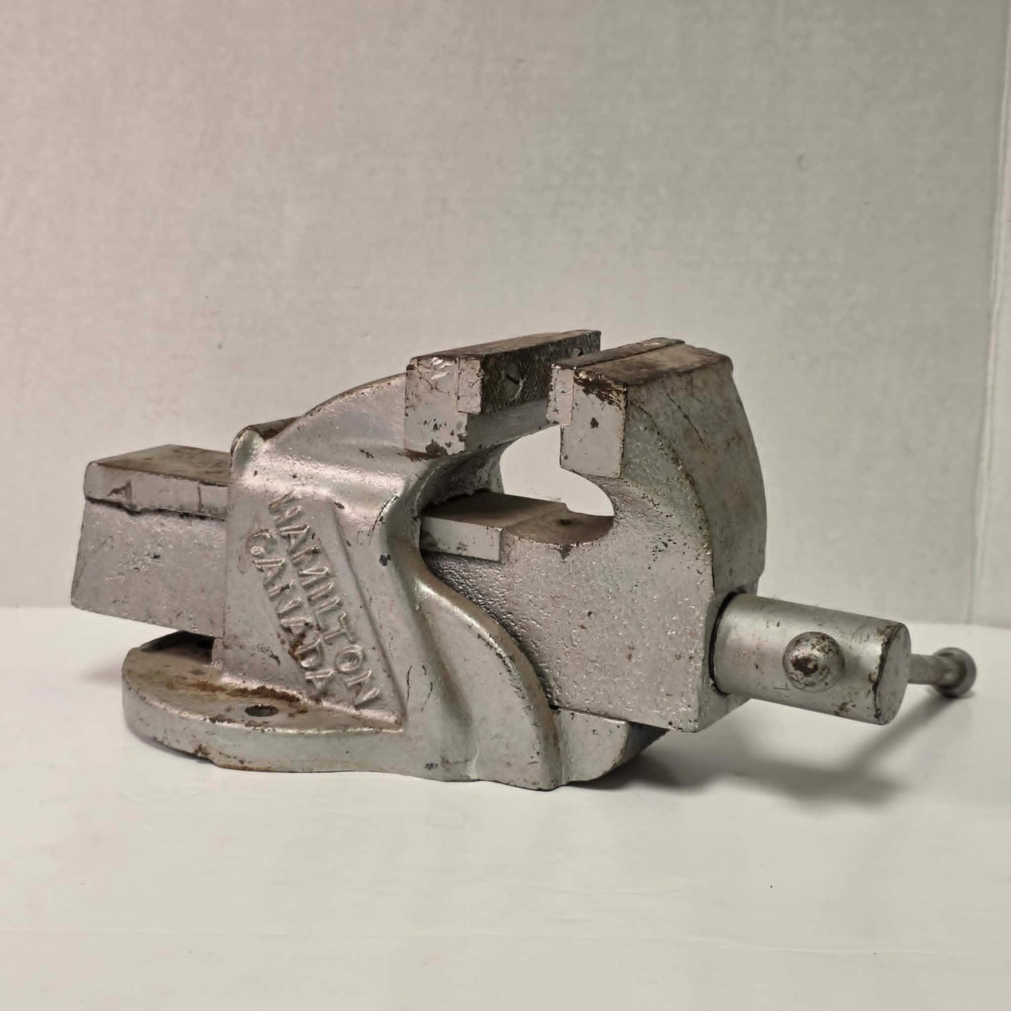 Heavy-duty antique RAE bench vise from Hamilton, Canada with 3.5-inch jaws and industrial steel construction.