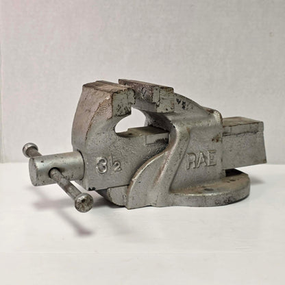 Heavy-duty antique RAE bench vise from Hamilton, Canada with 3.5-inch jaws and industrial steel construction.