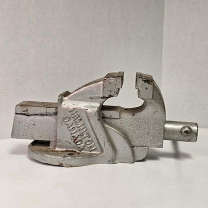 Heavy-duty antique RAE bench vise from Hamilton, Canada with 3.5-inch jaws and industrial steel construction.