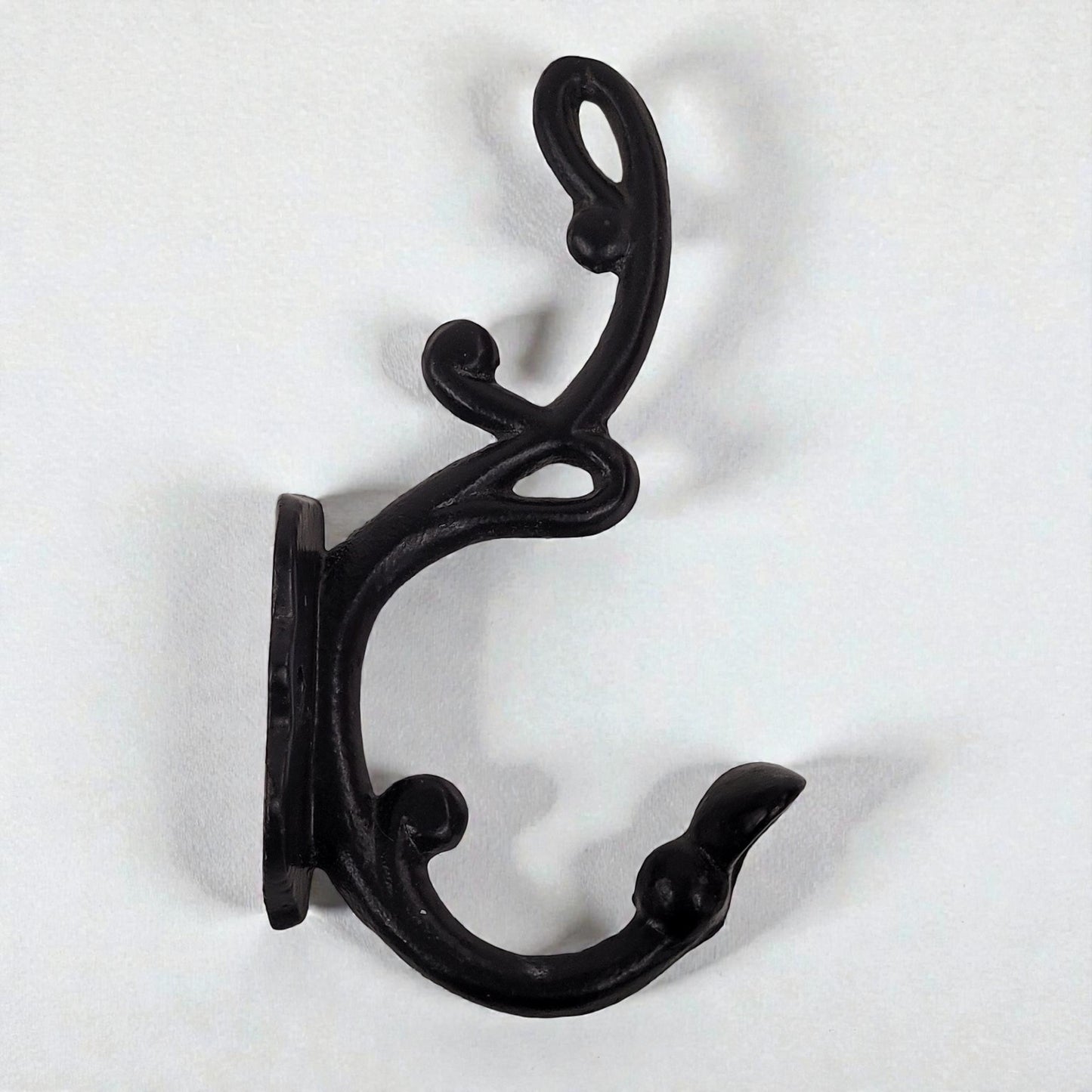 Black metal double hook on a white background
