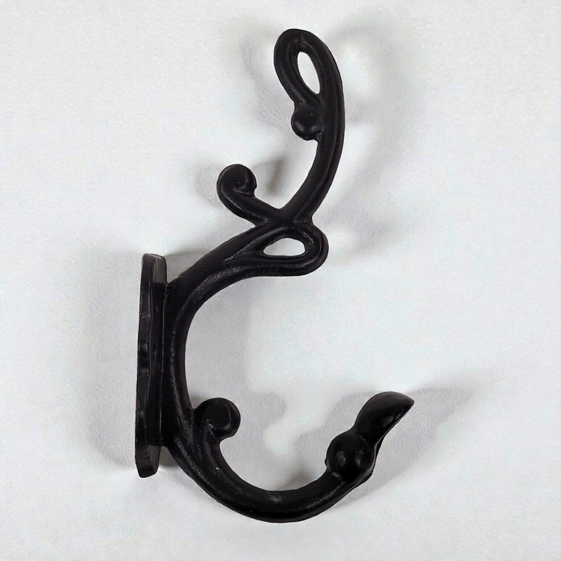 Black metal double hook on a white background