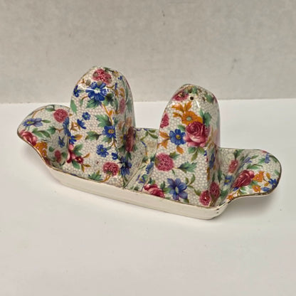 Antique Royal Grimwades Old Cottage Chintz salt and pepper shakers with matching tray.
