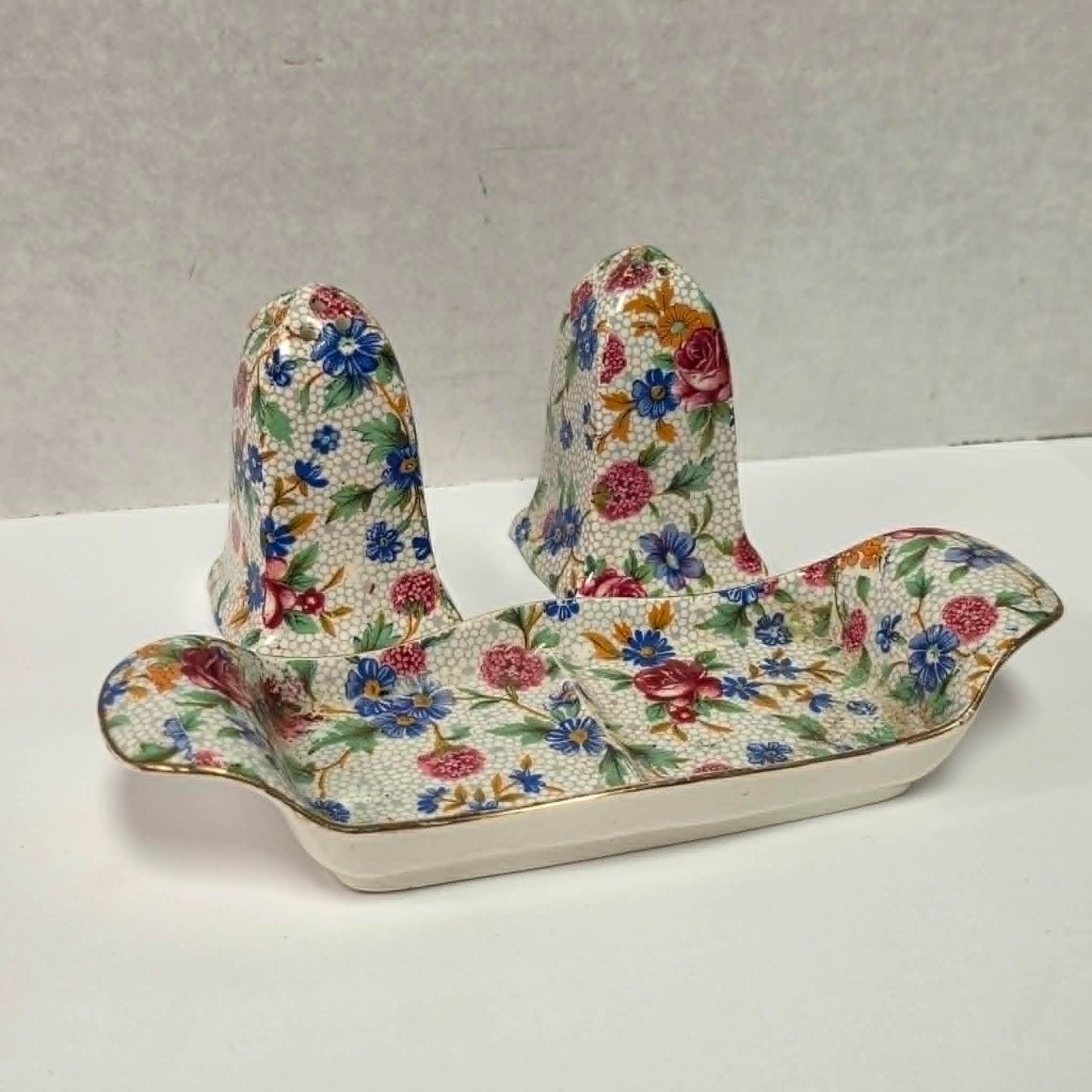 Antique Royal Grimwades Old Cottage Chintz salt and pepper shakers with matching tray.

