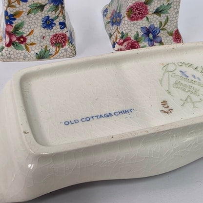 Antique Royal Grimwades Old Cottage Chintz salt and pepper shakers with matching tray.
