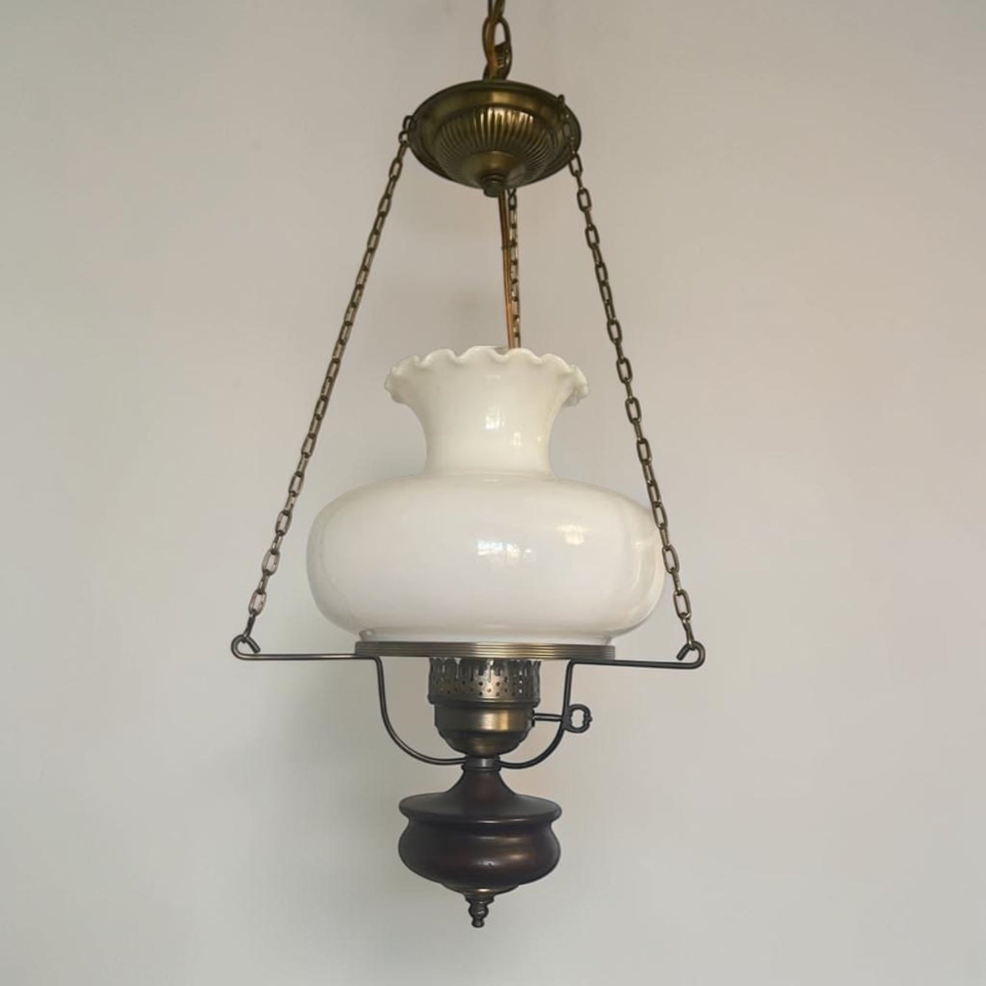 Classic mid-century modern milk glass pendant lamp, ready to brighten your home or vintage-inspired space.