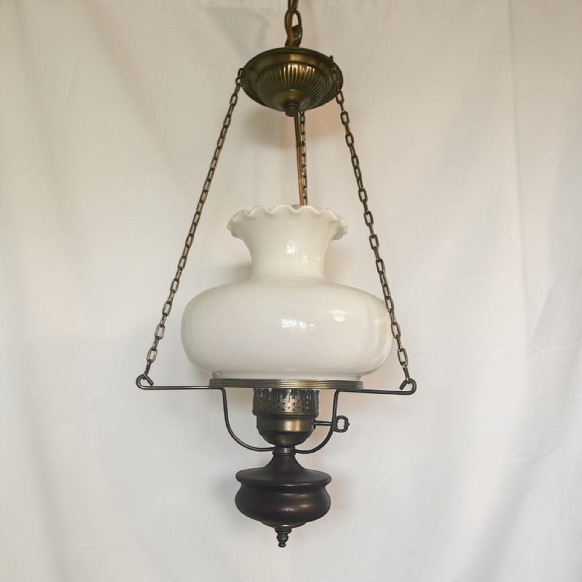 Classic mid-century modern milk glass pendant lamp, ready to brighten your home or vintage-inspired space.