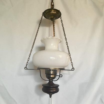 Classic mid-century modern milk glass pendant lamp, ready to brighten your home or vintage-inspired space.