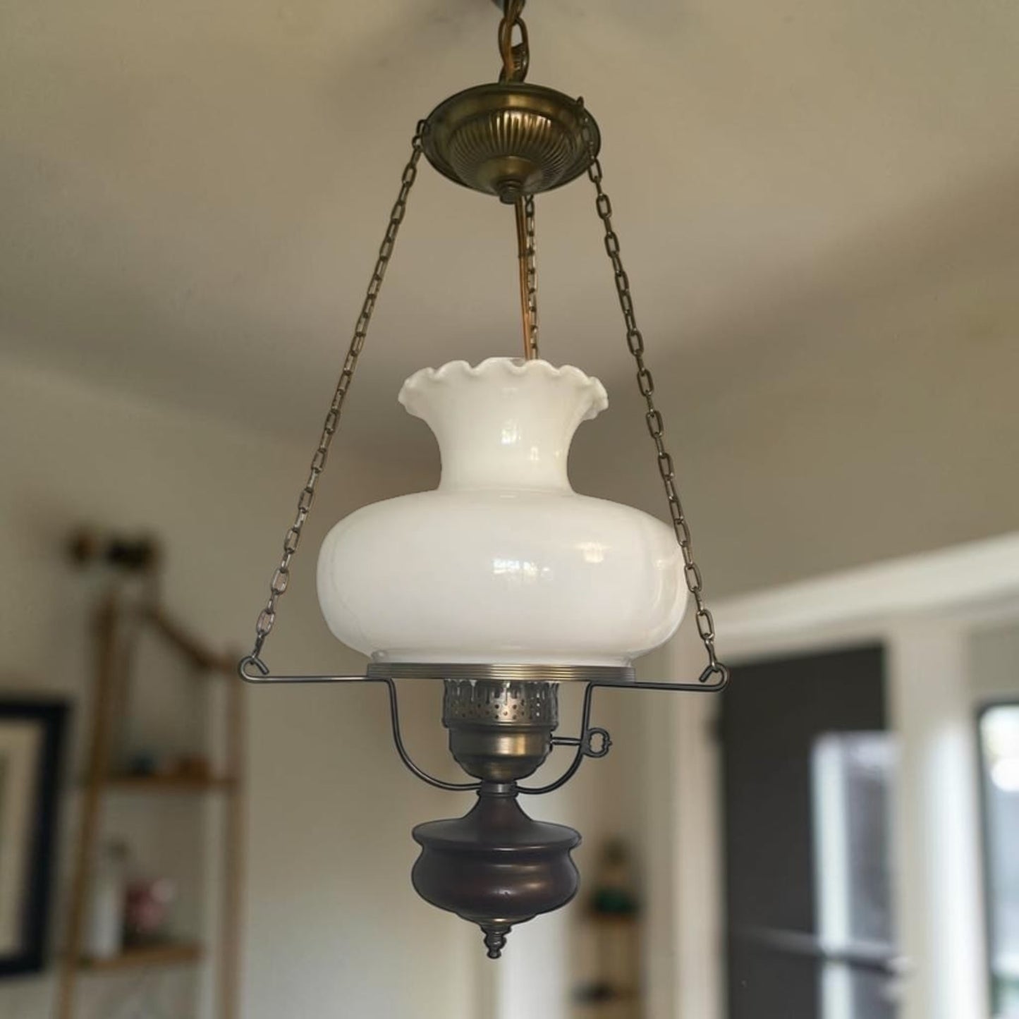 Classic mid-century modern milk glass pendant lamp, ready to brighten your home or vintage-inspired space.